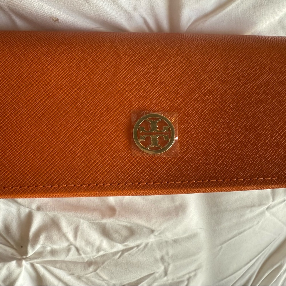 NEVER USED 
Tory Burch Vibrant Orange eye glass case